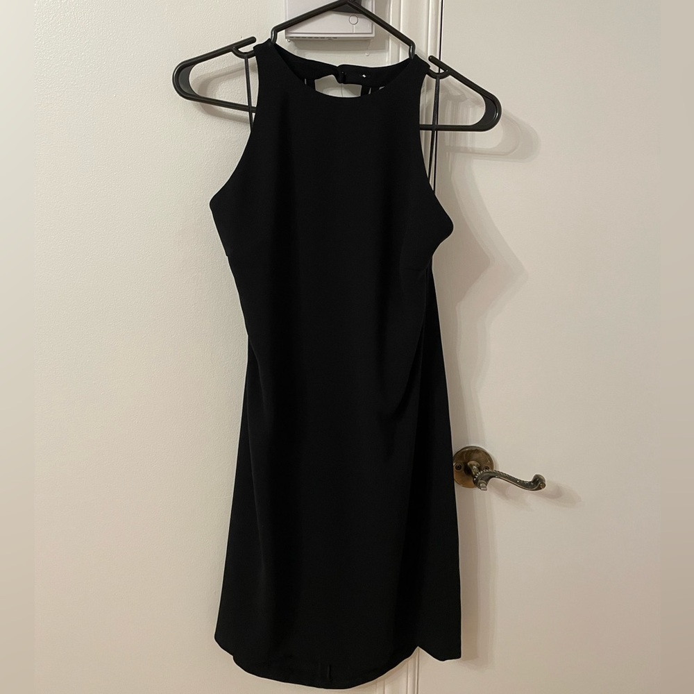Mini black dress with open back